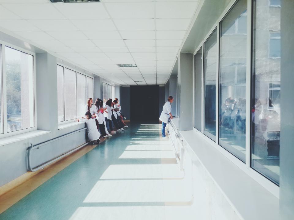 Hospital hallway and hospital employees