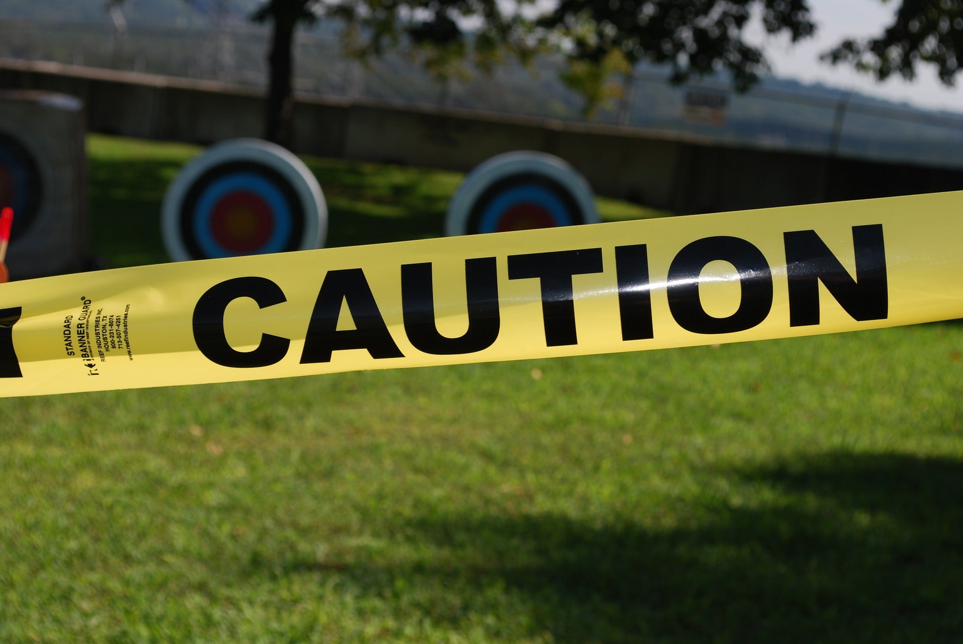 Caution tape, representing the caution issued against a pharmacist for an error by an employee