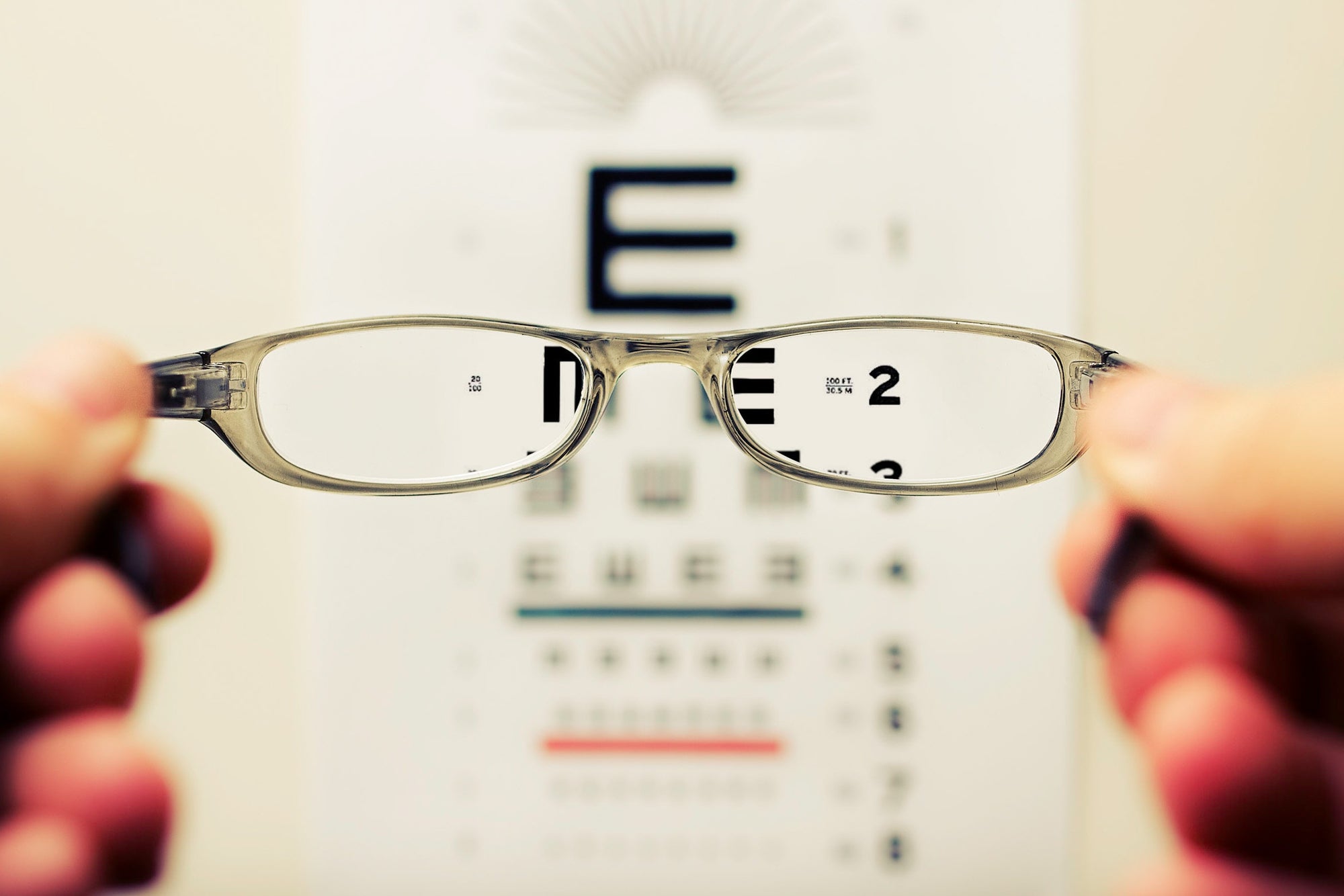 Wrongful delegation- eye chart seen through eyeglasses.