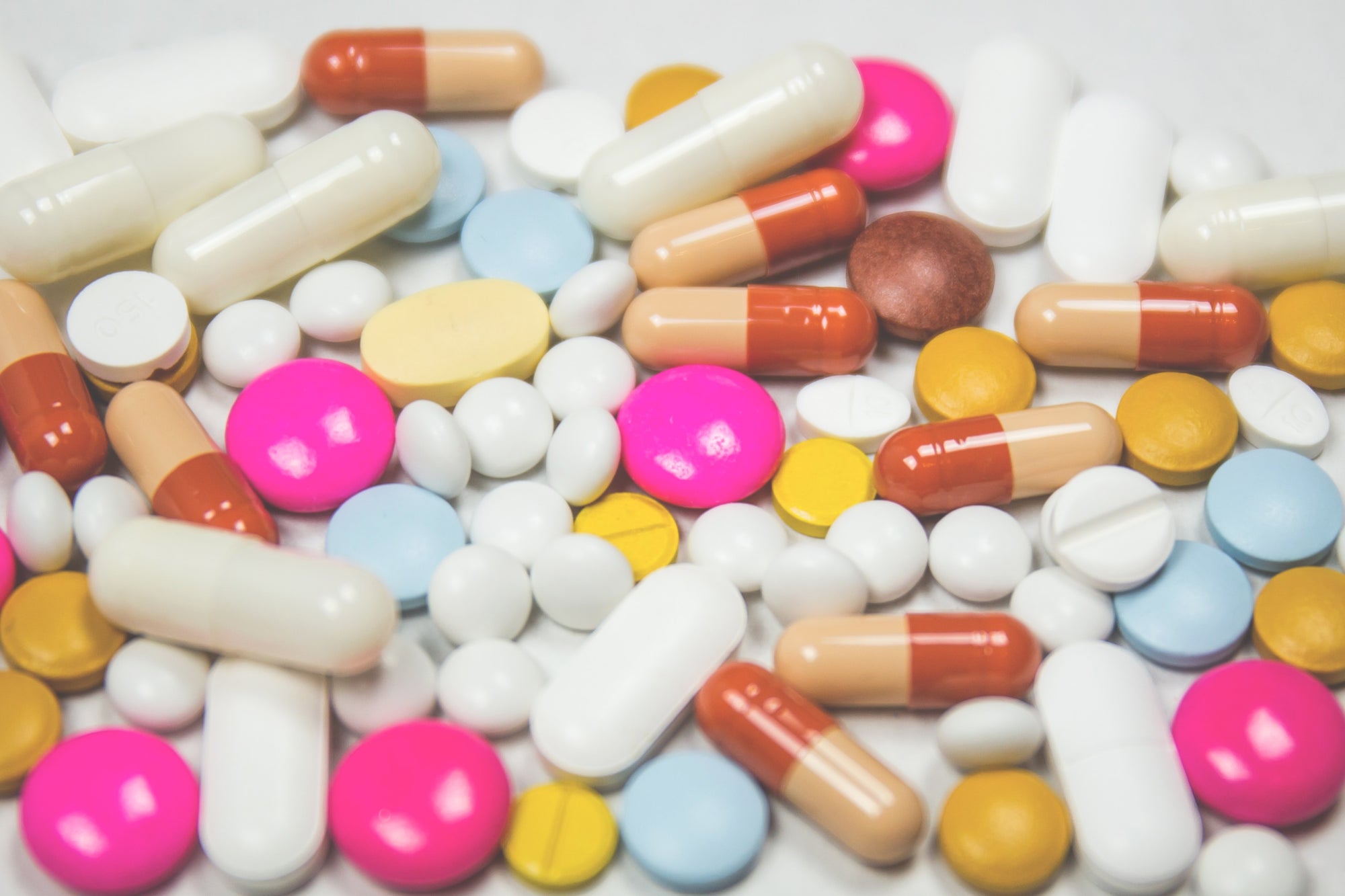 an assortment of prescription pills on a table